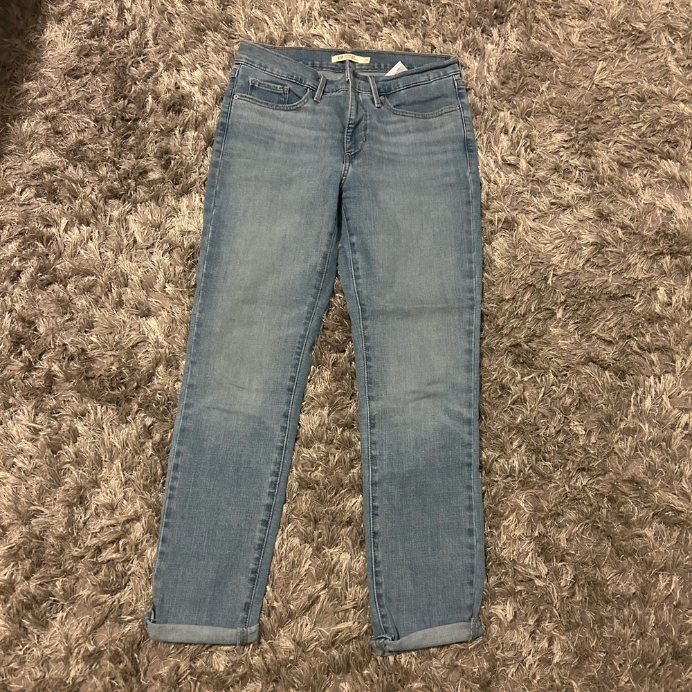 Levi’s 312 shaping slim jeans in light wash. Worn a few times.  Length is 30”